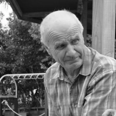 Allen, one of the two founders, outdoors in a black and white photograph.